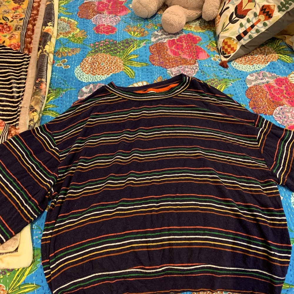 Knit top.  Size L.  Multi color but primarily dark blue.  Long crop; high hip.